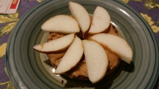 Half a whole-grain bagel with peanut butter and sliced apple